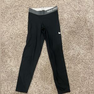 Women’s XS BLACK NIKE LEGGINGS WITH DIFFERENT MATERIAL ON CALVES OF BACK LEGS